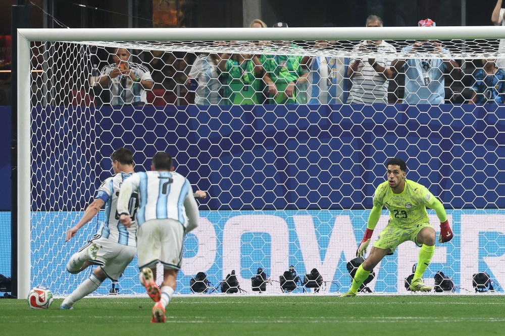 Argentina's forward #10 Lionel Messi shoots a penalty later stopped by Egypt's goalkeeper #23 Mostafa Shoubir on July 7, 2026. (Photo by Odd Andersen / AFP)