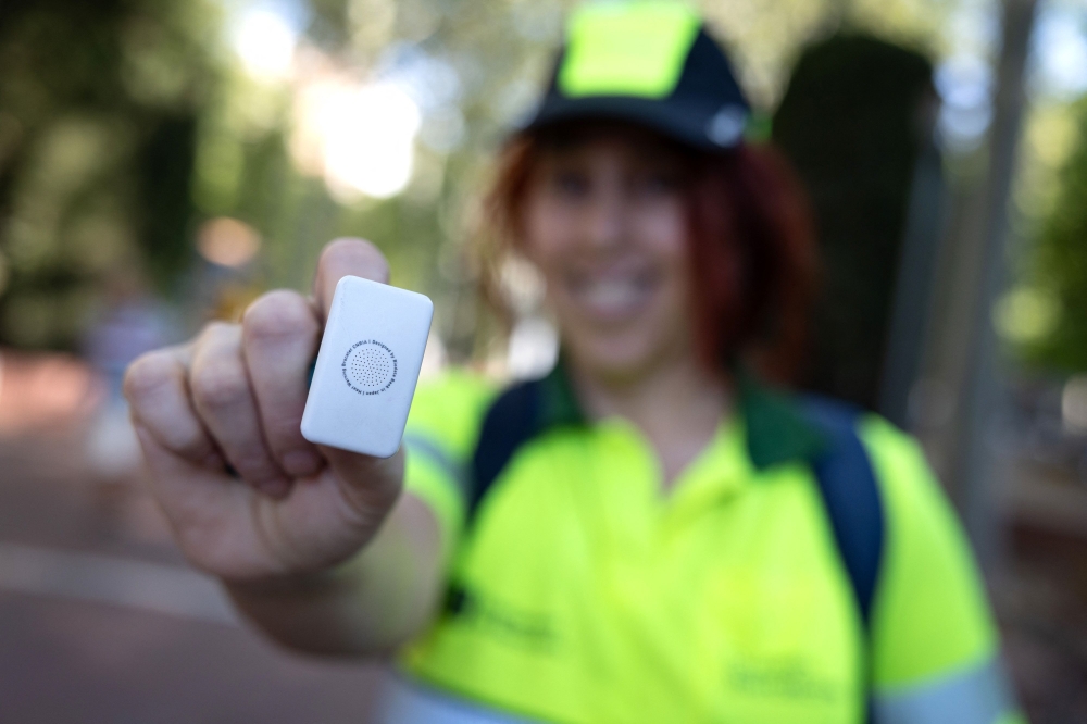 A picture taken on July 6, 2026 in Barcelona shows a gardener's wristband containing a sensor that detects body temperature. (Photo by Josep Lago / AFP)