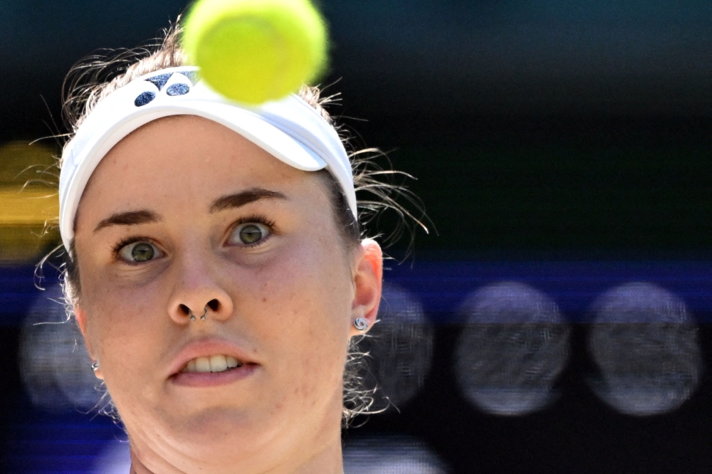 Czech Republic's Linda Noskova stares at the ball before returning to Belgium's Elise Mertens during their women's singles quarter-final tennis match on the tenth day of the 2026 Wimbledon Championships at The All England Lawn Tennis and Croquet Club in Wimbledon, southwest London, on July 8, 2026. (Photo by Kirill KUDRYAVTSEV / AFP)