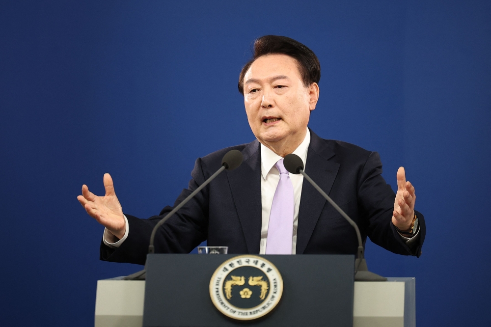 (Files) South Korean President Yoon Suk Yeol answers a reporter's question during a press conference at the Presidential Office in Seoul on November 7, 2024. (Photo by Kim Hong-Ji / Pool / AFP)