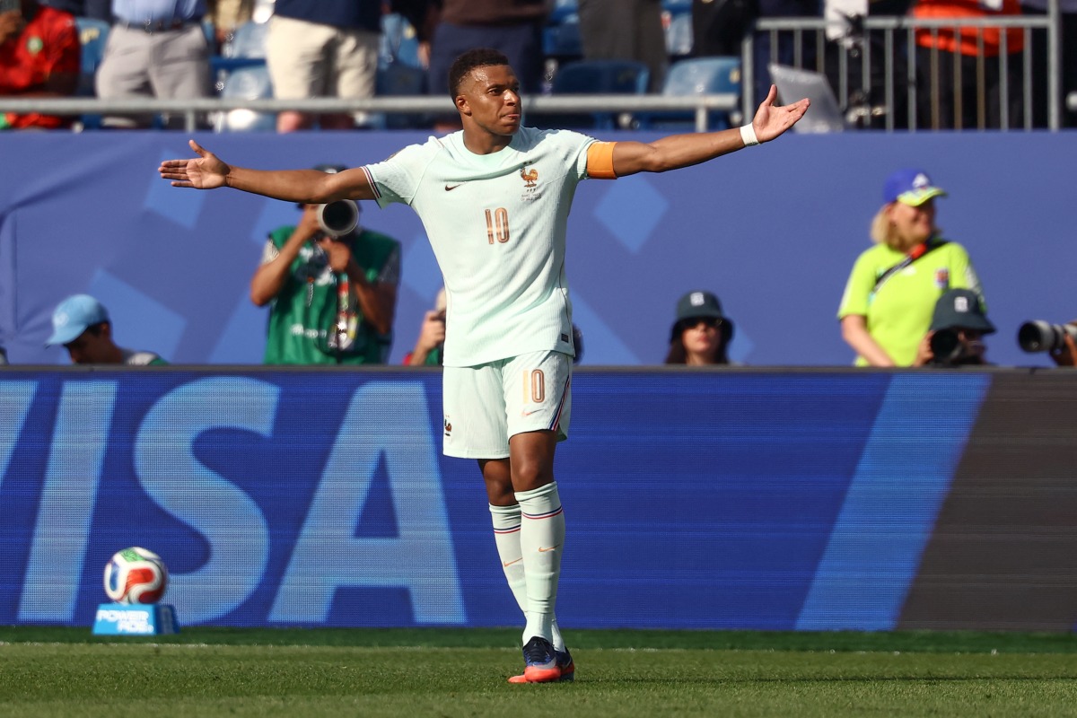 France's forward #10 Kylian Mbappe celebrates scoring his team's first goal during the 2026 World Cup football tournament quarter-final match between France and Morocco at Boston Stadium in Foxborough on July 9, 2026. (Photo by CHARLY TRIBALLEAU / AFP)
