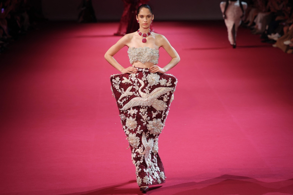  A model presents a creation by Manish Malhotra for the Women Haute Couture Fall/Winter 2026-2027 collection as part of the Paris Fashion Week, in Paris, on July 8, 2026. (Photo by Kenzo Tribouillard / AFP)