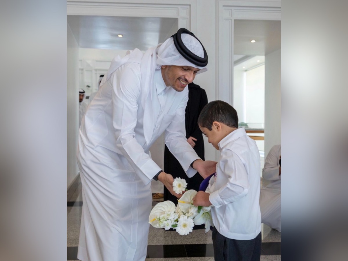 Prime Minister and Minister of Foreign Affairs H E Sheikh Mohammed bin Abdulrahman bin Jassim Al-Thani with a child. Picture shared by the Education Minister in a social media post.  
