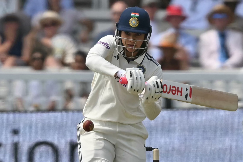 India's Smriti Mandhana hits a boundary on the first day of the first Women's cricket Test match between England and India at Lord's cricket ground in London, on July 10, 2026. (Photo by Justin Tallis / AFP)