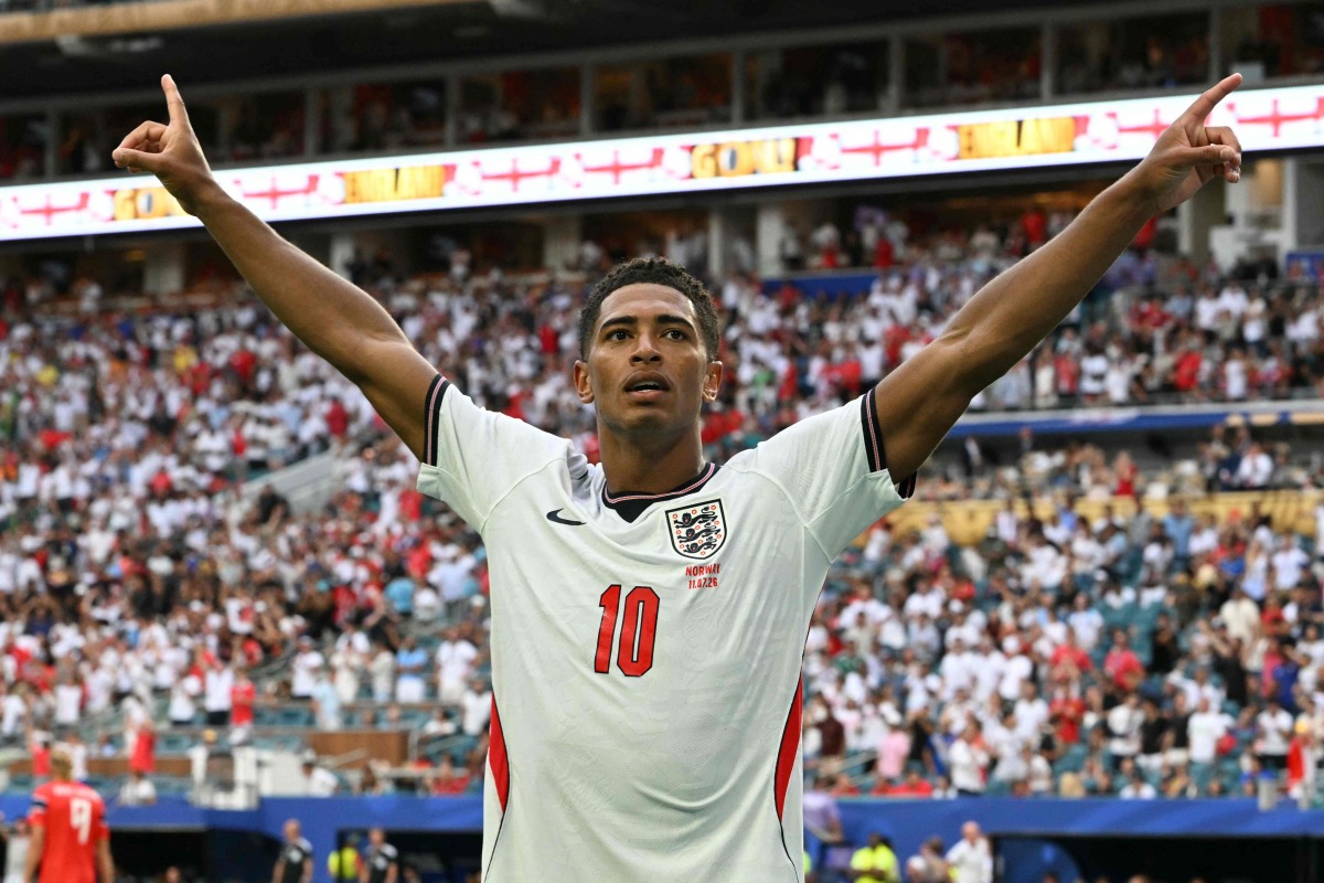 England's midfielder #10 Jude Bellingham celebrates after scoring his team's second goal during the 2026 World Cup football tournament quarter-final match between Norway and England at Miami Stadium in Miami on July 11, 2026. (Photo by ROBERTO SCHMIDT / AFP)