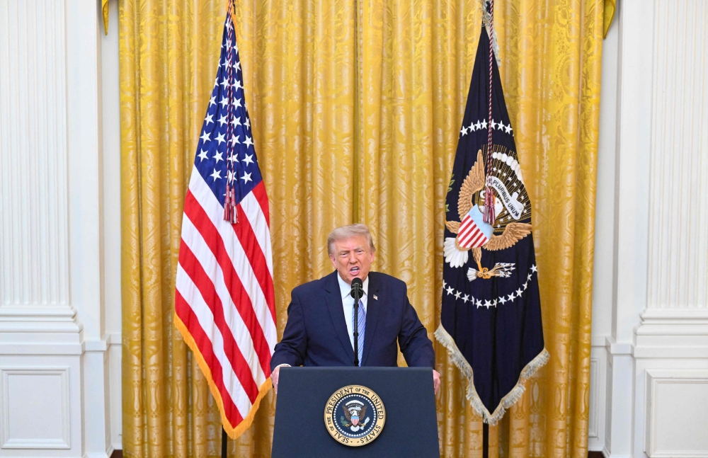 US President Donald Trump addresses the nation from the East Room of the White House in Washington, DC on July 16, 2026. (Photo by Saul Loeb / Pool / AFP)