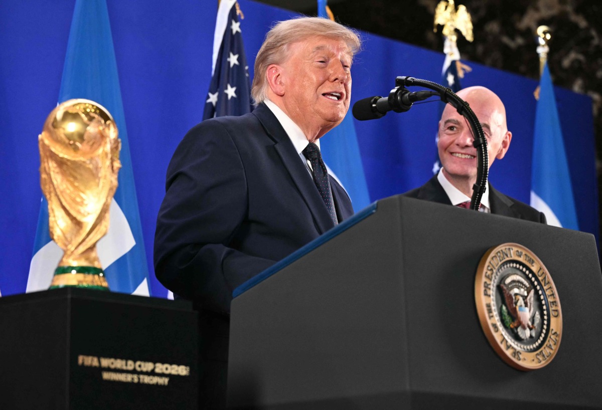 FIFA President Gianni Infantino (R) listens to US President Donald Trump speak during a FIFA reception at Trump Tower in New York on July 17, 2026. President Trump will attend the 2026 World Cup Final between Spain and Argentina. (Photo by Mandel NGAN / AFP)
