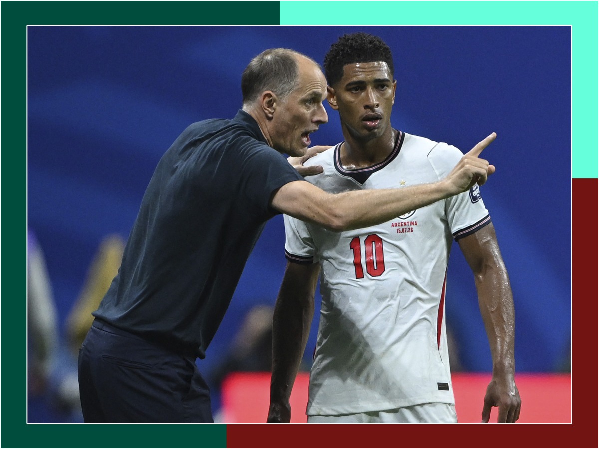 England coach Thomas Tuchel speaks with Jude Bellingham during the semi-final against Argentina. 