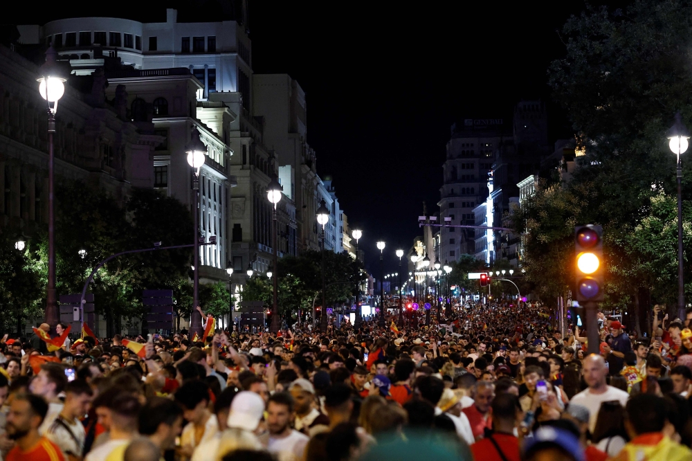 Spain's supporters celebrate victory after the 2026 World Cup final match between Spain and Argentina at Cibeles square and Gran Via avenue in Madrid, on July 19, 2026. (Photo by Oscar Del Pozo / AFP)