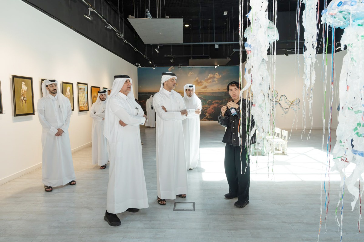 Officials and visitors at the exhibition.