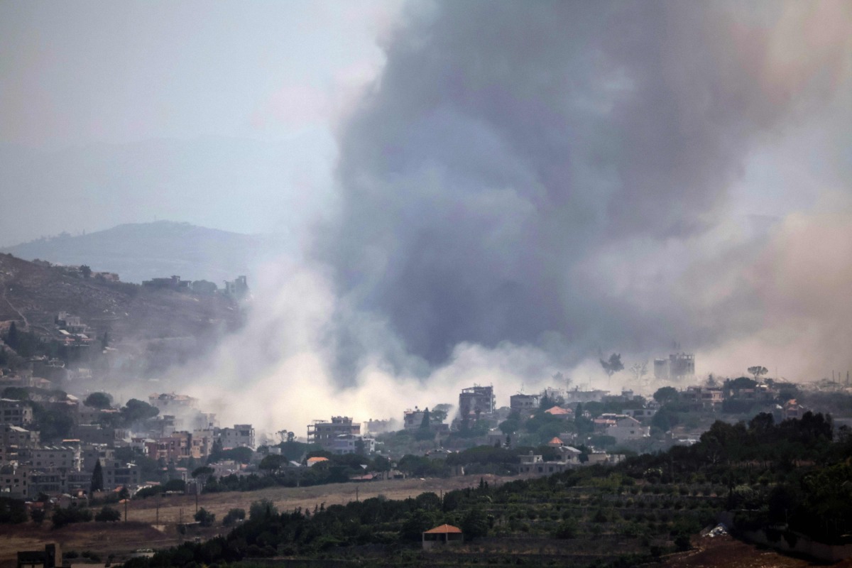 This image taken from the vicinity of the village Zawtar al-Sharqiyah in southern Lebanon, shows smoke rising from the site of an explosion carried out by the Israeli military, in the village of Kfar Tibnit on July 23, 2026. (Photo by ibrahim AMRO / AFP) /
