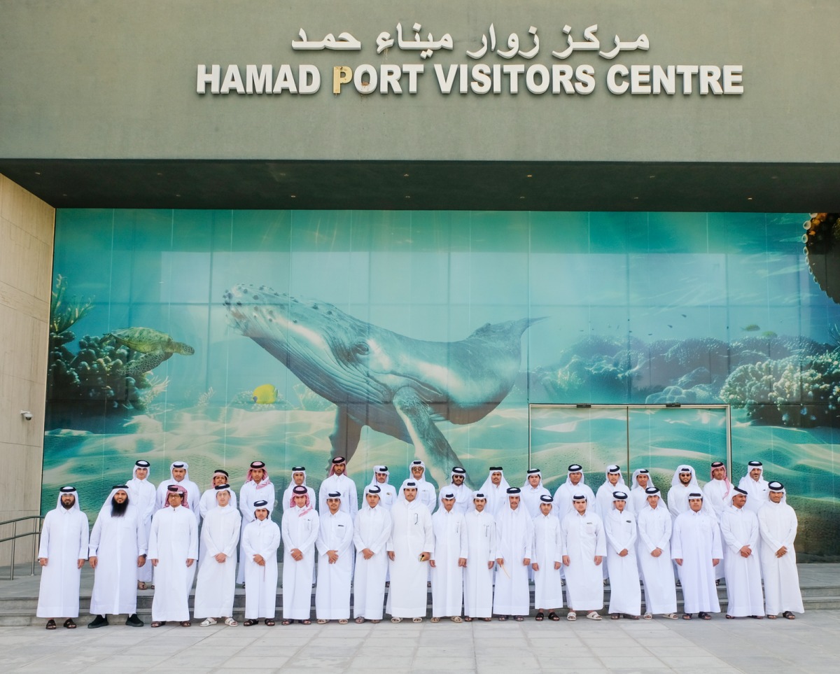 Officials and students at Hamad Port Visitors Centre. 