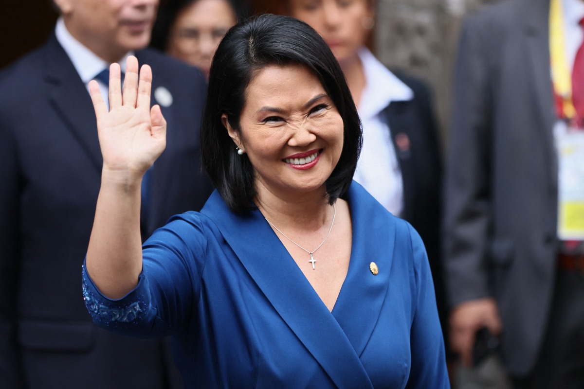 Peru's president-elect Keiko Fujimori waves as she leaves the Foreign Affairs Ministry building for the Congress building after bilateral meetings with heads of state in Lima, on July 28, 2026, ahead of her inauguration. (Photo by Connie FRANCE / AFP)
