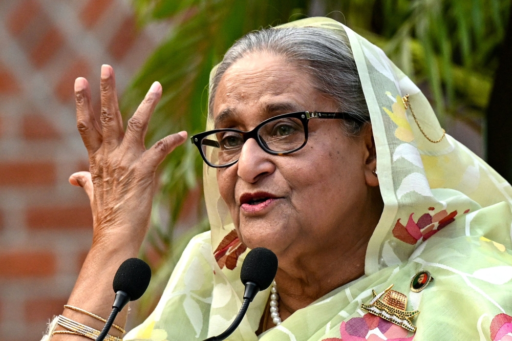(Files) Bangladesh's Prime Minister Sheikh Hasina gestures while speaking to the media in Dhaka on January 8, 2024. (Photo by Indranil Mukherjee / AFP)
