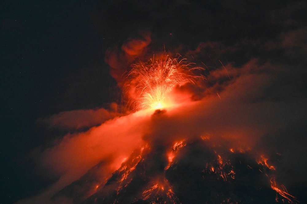 The Fuego volcano erupts 65 kilometers southwest of Guatemala City on August 3, 2026. (Photo by Johan ORDONEZ / AFP)
