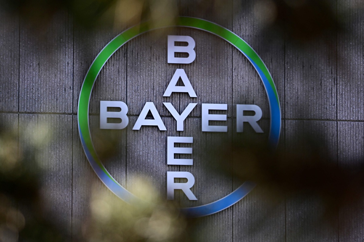 The company logo of German chemical giant Bayer is pictured at the company's site in Berlin on March 4, 2026. Photo by Tobias SCHWARZ / AFP