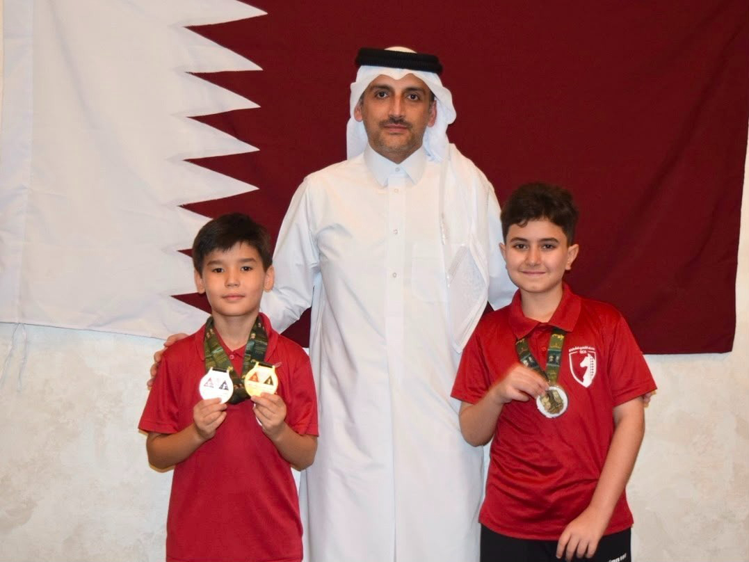 Qatar Chess Association Executive Director Hamad Al Tamimi with Mohammed Jarbi and Khalid Al Jumaat.