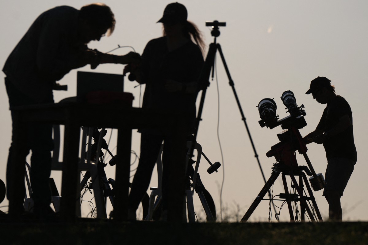 Researchers from San Francisco's Exploratorium museum carry out preparations for the global live broadcast of the upcoming August 12 total solar eclipse, in the abandoned village of Villalibado, near Burgos, northern Spain, on August 10, 2026. Photo by CESAR MANSO / AFP
