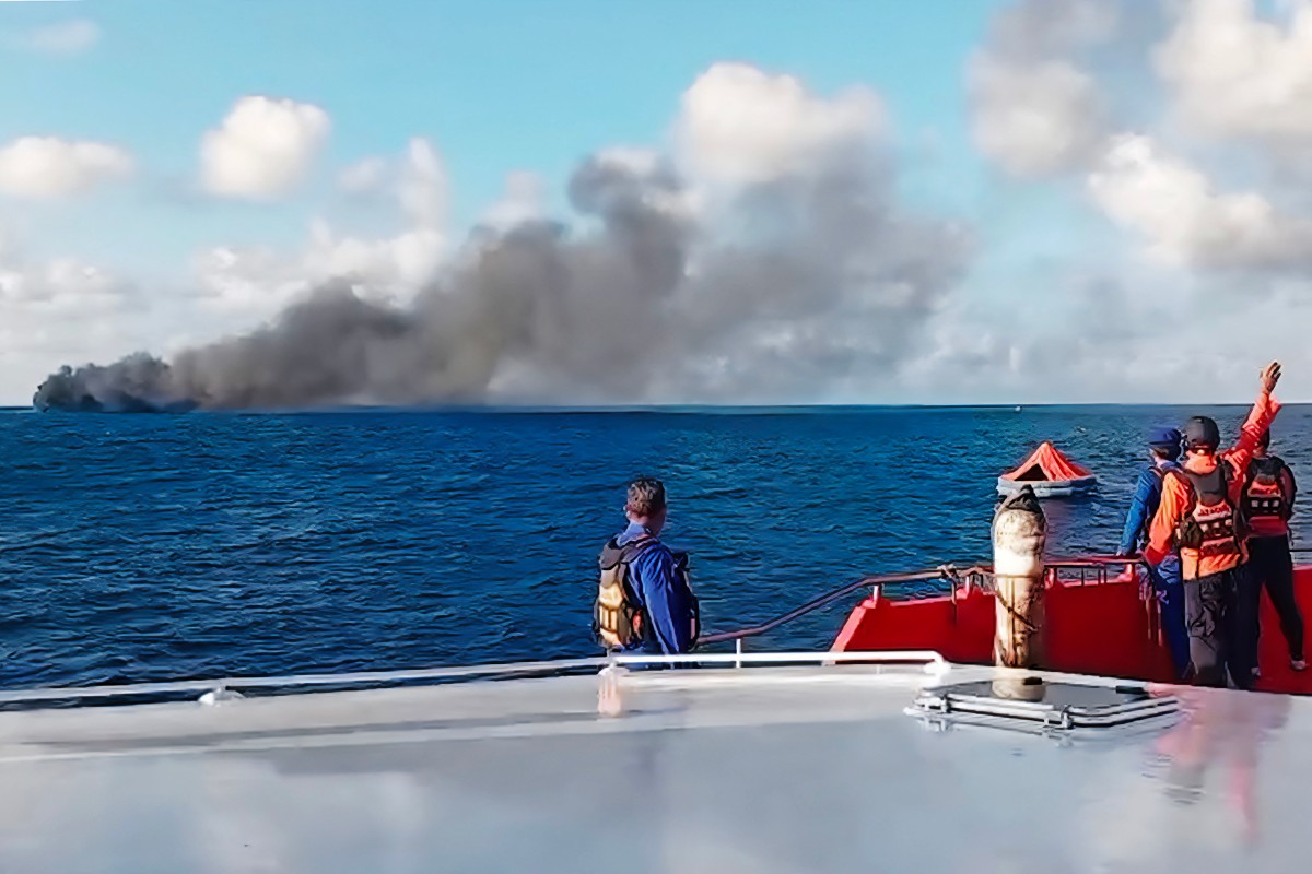 This screen grab picture from a handout video taken and released on August 12, 2026 by the Indonesian National Search and Rescue Agency (Basarnas) shows the Putri Yasmin ferry, which serves the Padangbai-Bali- to Lembar-West Nusa Tenggara route, on fire in the waters of Bali. (Photo by Handout (Green Road Waste Management )
