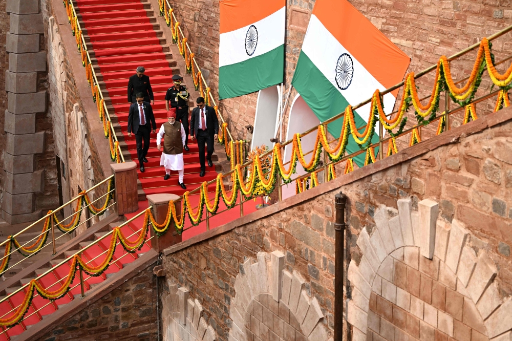 India's Prime Minister Narendra Modi (C, front) leaves after addressing the nation from the ramparts of the Red Fort during the celebrations to mark the country's Independence Day in New Delhi on August 15, 2026. (Photo by Sajjad HUSSAIN / AFP)
