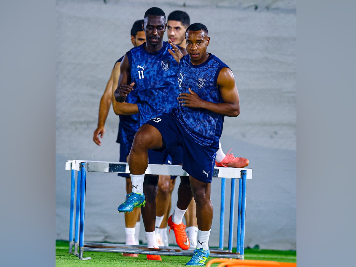 Al Duhail players attend a training session.