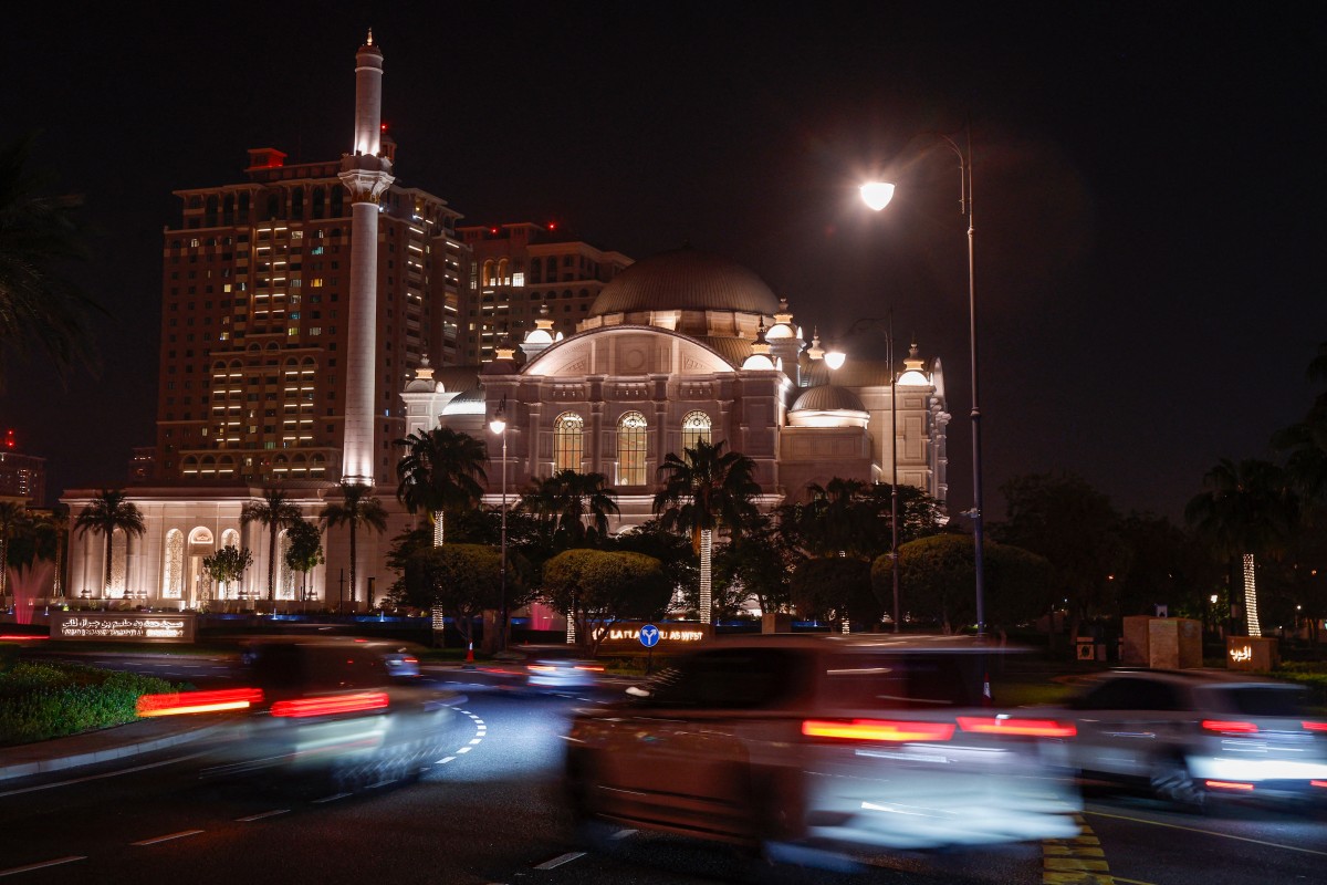 Motorists drive past the Hamad bin Jassim bin Jaber Al Thani Mosque at the Pearl Island in Doha on August 13, 2026. (Photo by KARIM JAAFAR / AFP)
