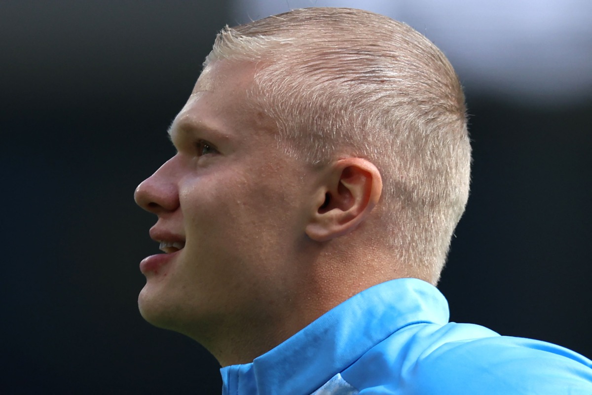 Manchester City's Norwegian striker #09 Erling Haaland, sporting a new hair cut, warms up ahead of the English Premier League football match between Manchester City and AFC Bournemouth at the Etihad Stadium in Manchester, north west England, on August 23, 2026. (Photo by Darren Staples / AFP) 