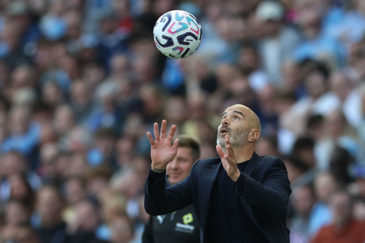 Manchester City's Italian manager Enzo Maresca catches the ball during the English Premier League football match between Manchester City and AFC Bournemouth at the Etihad Stadium in Manchester, north west England, on August 23, 2026. (Photo by Darren Staples / AFP) 