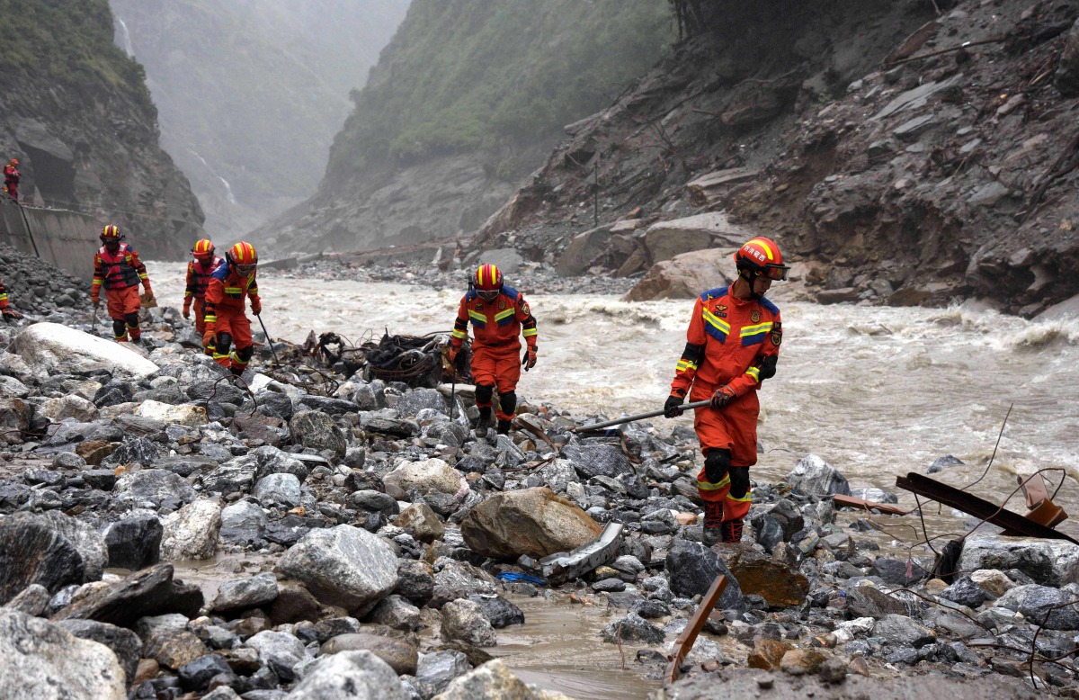 Fire and rescue personnel conduct search and rescue operations 2 kilometers from Gyirong Port days after the August 26 mudslide which destroyed the port, in Gyirong County, in China western Tibet region on August 29, 2026. (Photo by CNS / AFP) 