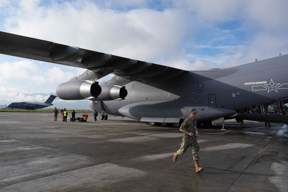 Two Chinese Y-20 transport planes carrying 50 tonnes of emergency relief supplies and four tunnel rescue experts arrive at Tribhuvan International Airport in Kathmandu, Nepal, on August 30, 2026. Photo by CNS / AFP