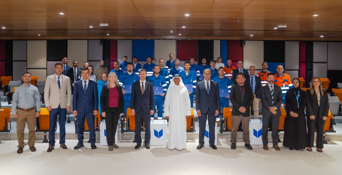 UDST President Dr. Salem Al-Naemi with officials, professors and young professionals from Uzbekistan during the completion of a 10-month vocational training programme.