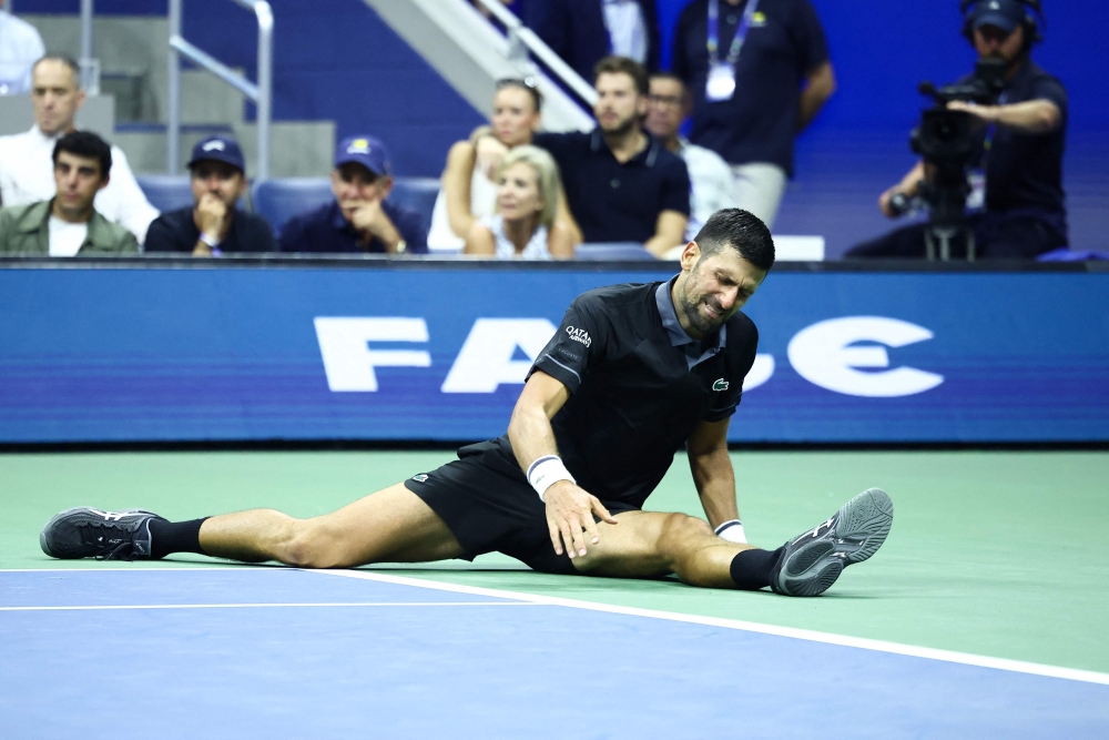 Serbia's Novak Djokovic reacts against Argentina's Mariano Navone during the men's singles first round tennis match on day one of the US Open tennis tournament at the USTA Billie Jean King National Tennis Center in New York City on August 30, 2026. (Photo by CHARLY TRIBALLEAU / AFP)