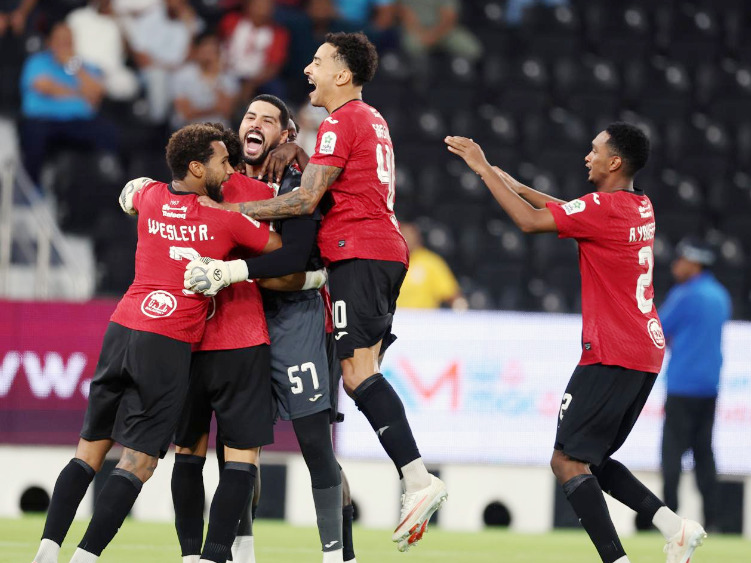 Al Rayyan players celebrate their win over Al Shamal.