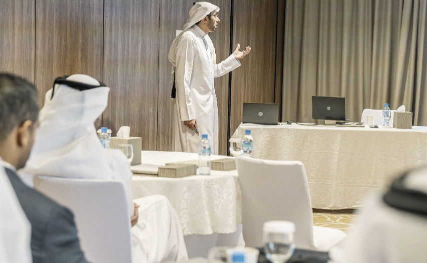 An MoJ official presents key data findings to attendees.