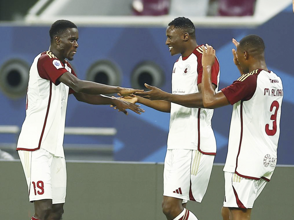 Al Arabi’s Issa Laye (left) celebrates with teammates after scoring against Al Sailiya.  
