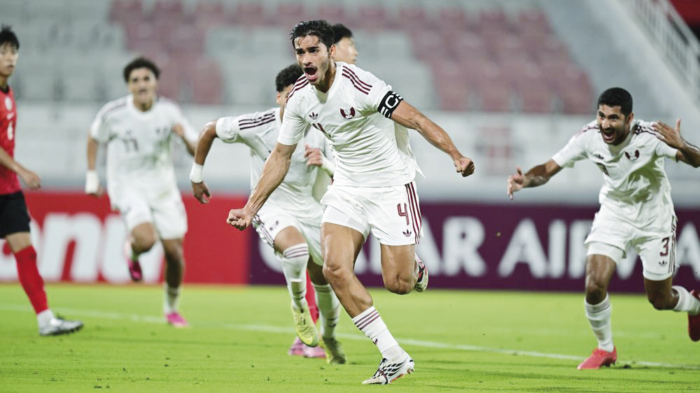 Qatar’s Ahmad Al-Sayed celebrates after scoring team’s first goal. 