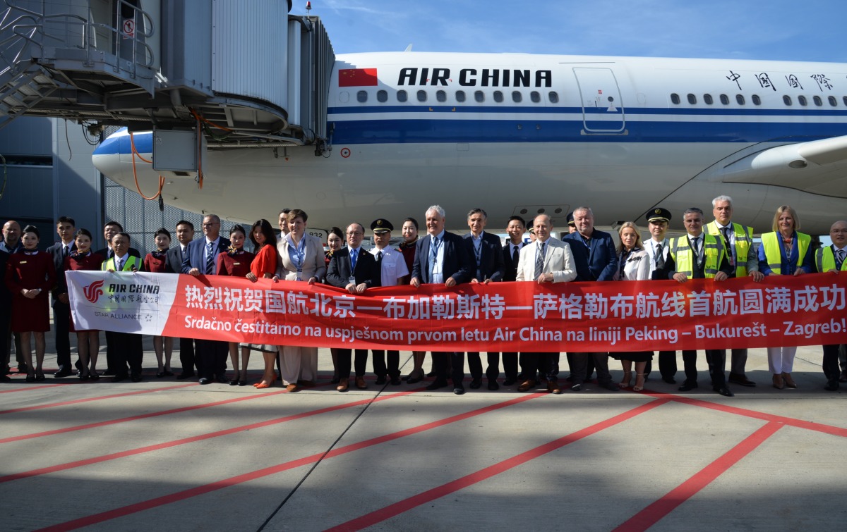 People pose for a group photo after the arrival of the first direct Beijing-Bucharest-Zagreb flight at the International Zagreb Airport in Zagreb, Croatia, Sept. 4, 2026. (Xinhua/Ma Zhen)