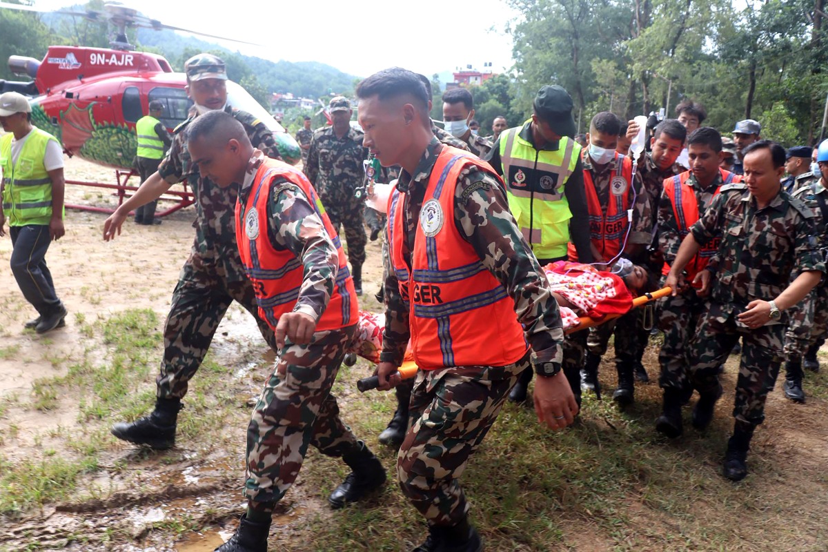 Rescuers transfer a worker rescued alive in Rasuwa district, Nepal, Sept. 4, 2026. (RSS via Xinhua)