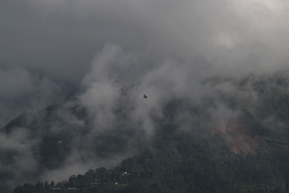 A helicopter takes off from a temporary relief camp in the aftermath of flash floods at Trishuli Bazar, Nepal's Nuwakot district, on September 6, 2026. (Photo by Prakash MATHEMA / AFP)
 