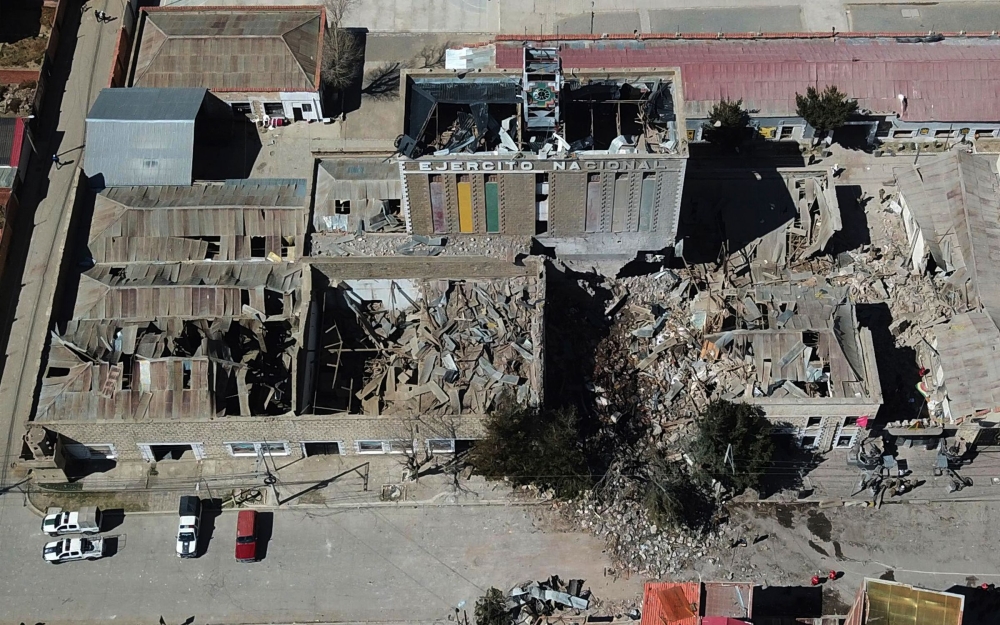This aerial view show the army barracks after an explosion on the eve, in Viacha, Bolivia, on September 5, 2026. At least two people were killed, 81 injured, and 14 people are still missing after a powerful explosion on September 4, 2026 at a military facility storing pyrotechnic material in Bolivia. The cause of the blast remains under investigation. (Photo by Aizar RALDES / AFP)