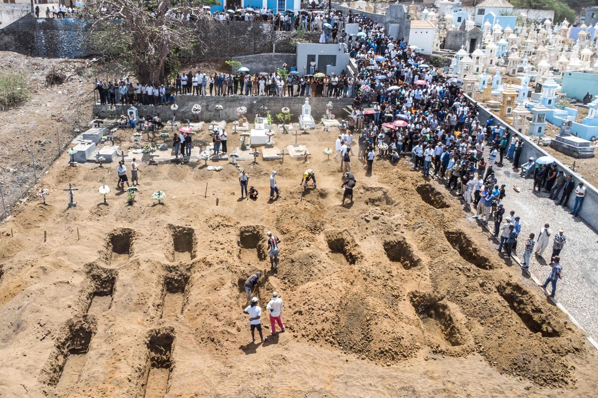 An aerial view of residents and relatives of the victims killed in a bus crash gathering during their funeral at Sao Lourenco Church in the town of Sao Lourenco, on the island of Fogo, on September 6, 2026. (Photo by Herculano da Luz / AFP)