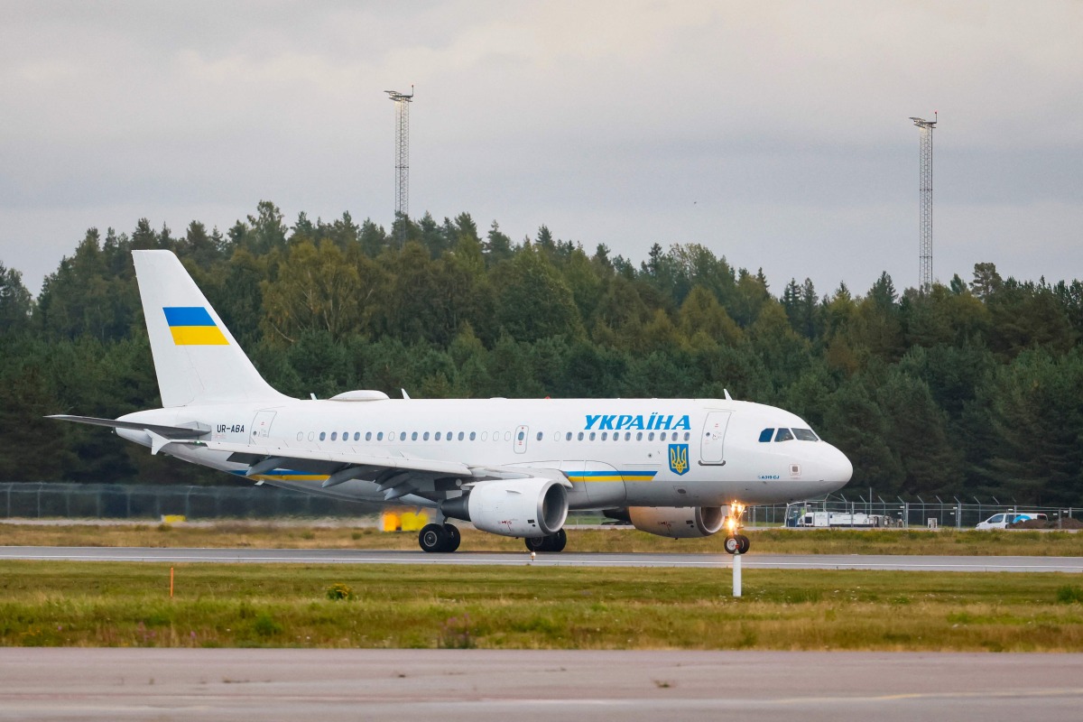 Ukrainian plane UR-ABA believed to carry Ukraine's President Volodymyr Zelensky and his and his wife Olena Zelenska lands at Gardermoen airport near Oslo before Norway's King Harald V's funeral on September 9, 2026 in Oslo. (Photo by Frederik Ringnes / NTB / AFP) / Norway OUT