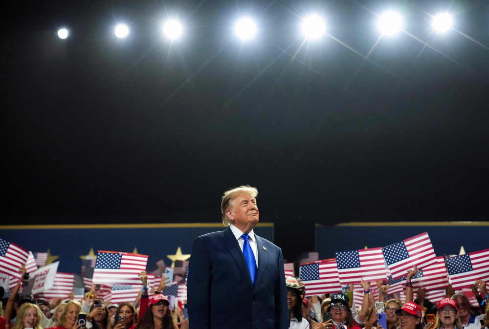 US President Donald Trump walks on stage to speak on the first day of the 2026 Republican National Convention at the American Airlines Center on September 09, 2026 in Dallas, Texas. Andrew Harnik/Getty Images/AFP