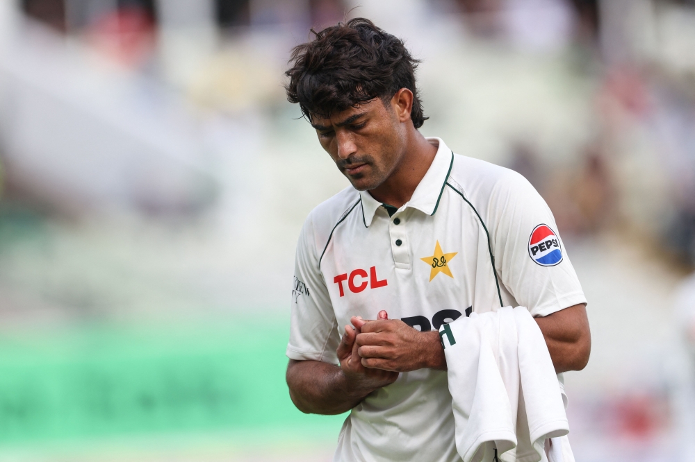 Pakistan's Razaullah leaves the field for treatment on an injury on day four of the third Test match between England and Pakistan at Edgbaston cricket ground in Birmingham on September 12, 2026. (Photo by Darren Staples / AFP) 