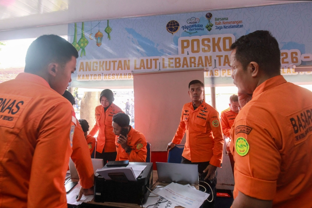 National Search and Rescue Agency (Basarnas) officers staff a rescue operations command post for the stricken Virgo Transport 8 ferry, at Trisakti Bandarmasih Port in Banjarmasin, South Kalimantan, on September 13, 2026. (Photo by INFUZ / AFP)