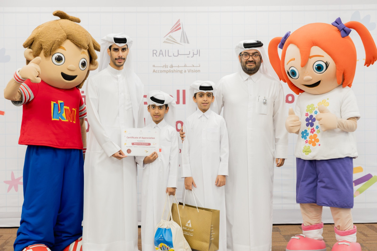 Officials with children during the event.