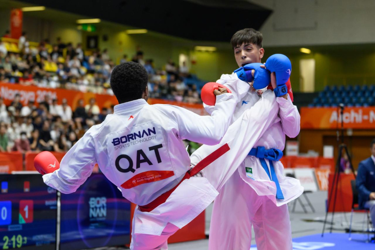 Qatar's Abdullah Rashad Mohi El Din Babiker in action against Palestine’s Abdullah Al Khatib.