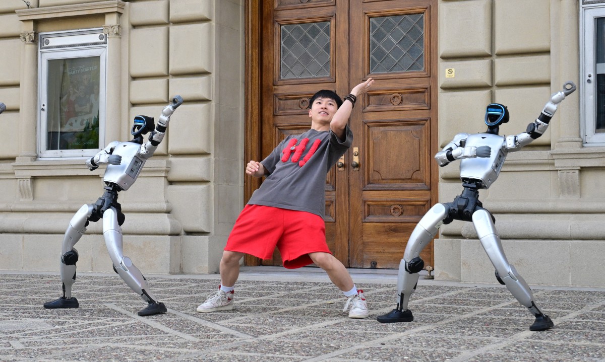 Chinese street dancer Wu Yufei performs alongside Unitree Robotics humanoid robots during a demonstration in Pasadena, California, on September 17, 2026. Photo by Frederic J. Brown / AFP