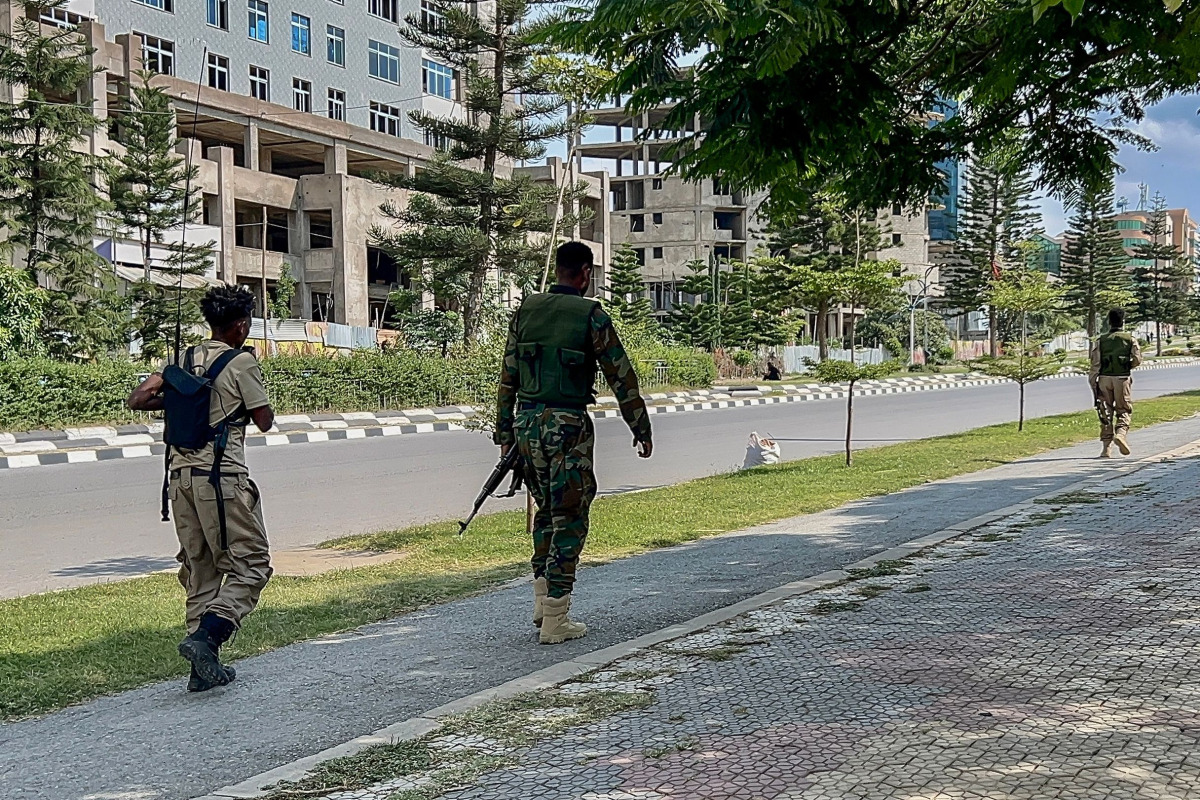Members of the Tigray People's Liberation Front (TPLF) walk along a main road in Mekelle on September 23, 2026, as tensions intensify in northern Ethiopia after Tigrayan forces seized control of airports in the region. (Photo by AFP)