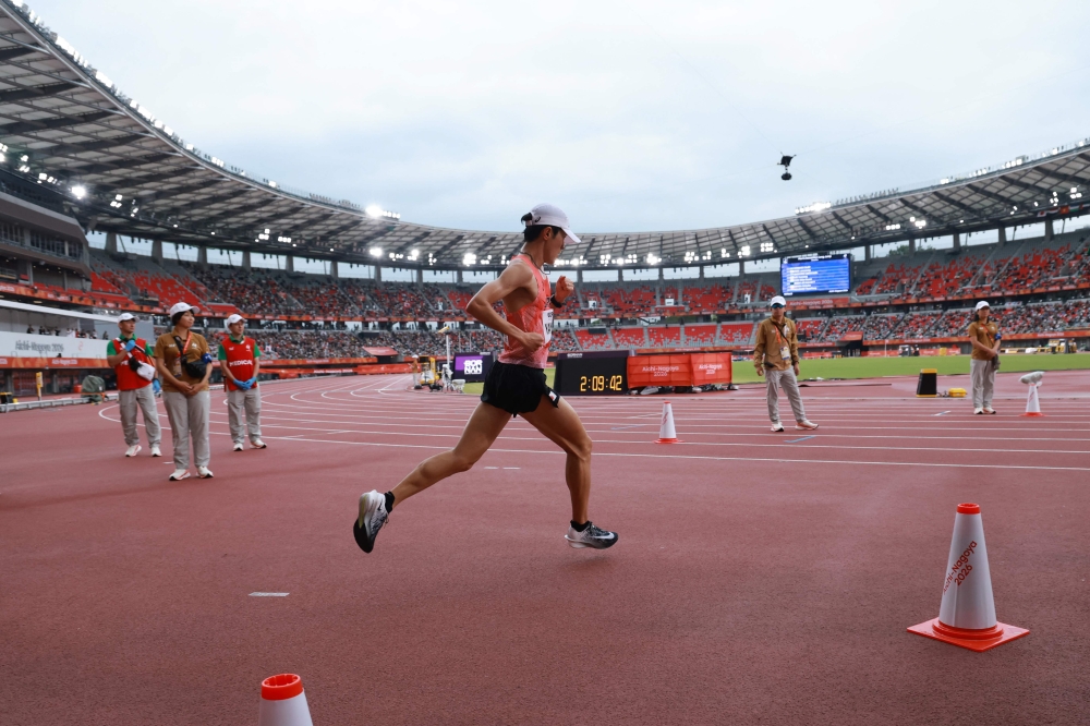 Japan's Ichitaka Yamashita enters the stadium during the 2026 Asian Games at Nagoya City Mizuho Park Athletic Stadium in Nagoya, Aichi Prefecture on September 26, 2026. (Photo by David Gray / AFP)